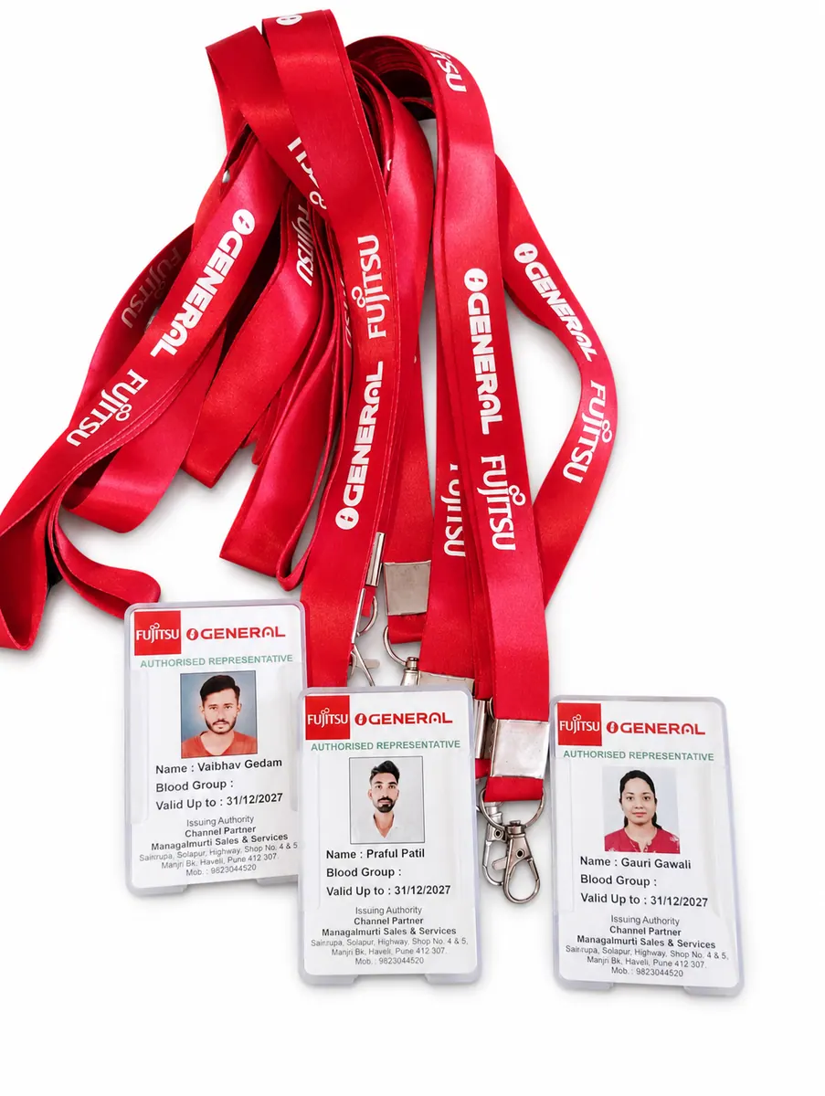 Red Fujitsu General lanyards and employee ID cards on a clean white background
